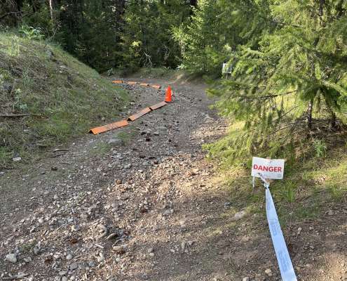 mountain trail with "danger" sign